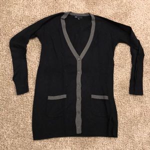 Navy gap sweater with gray trim.